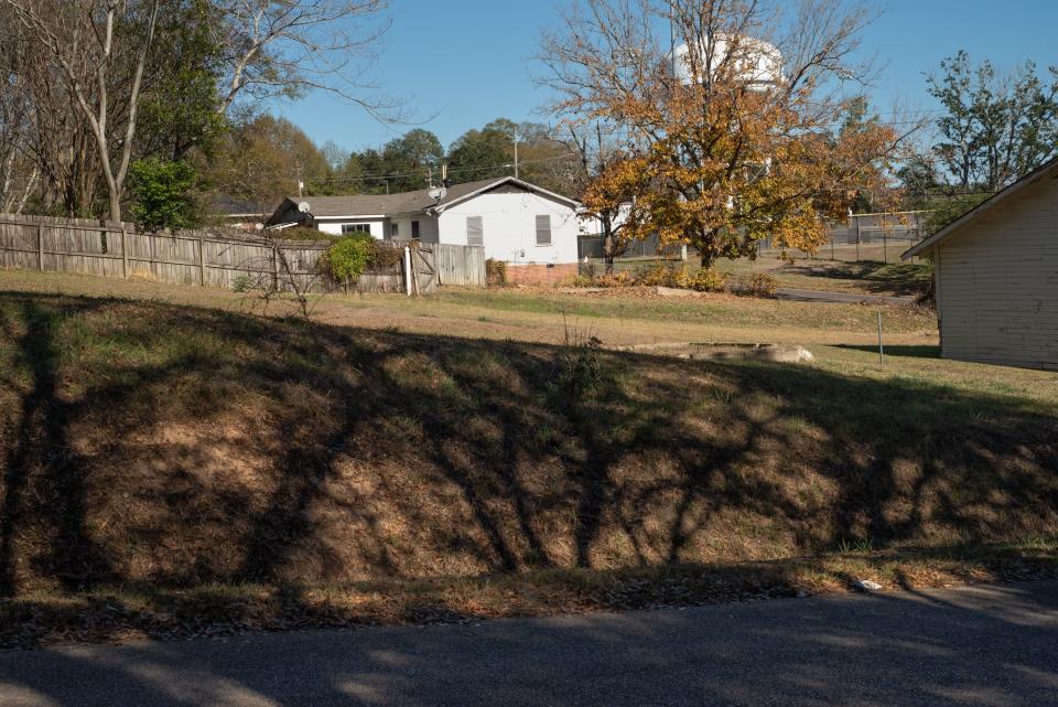 A small white home on a rural road