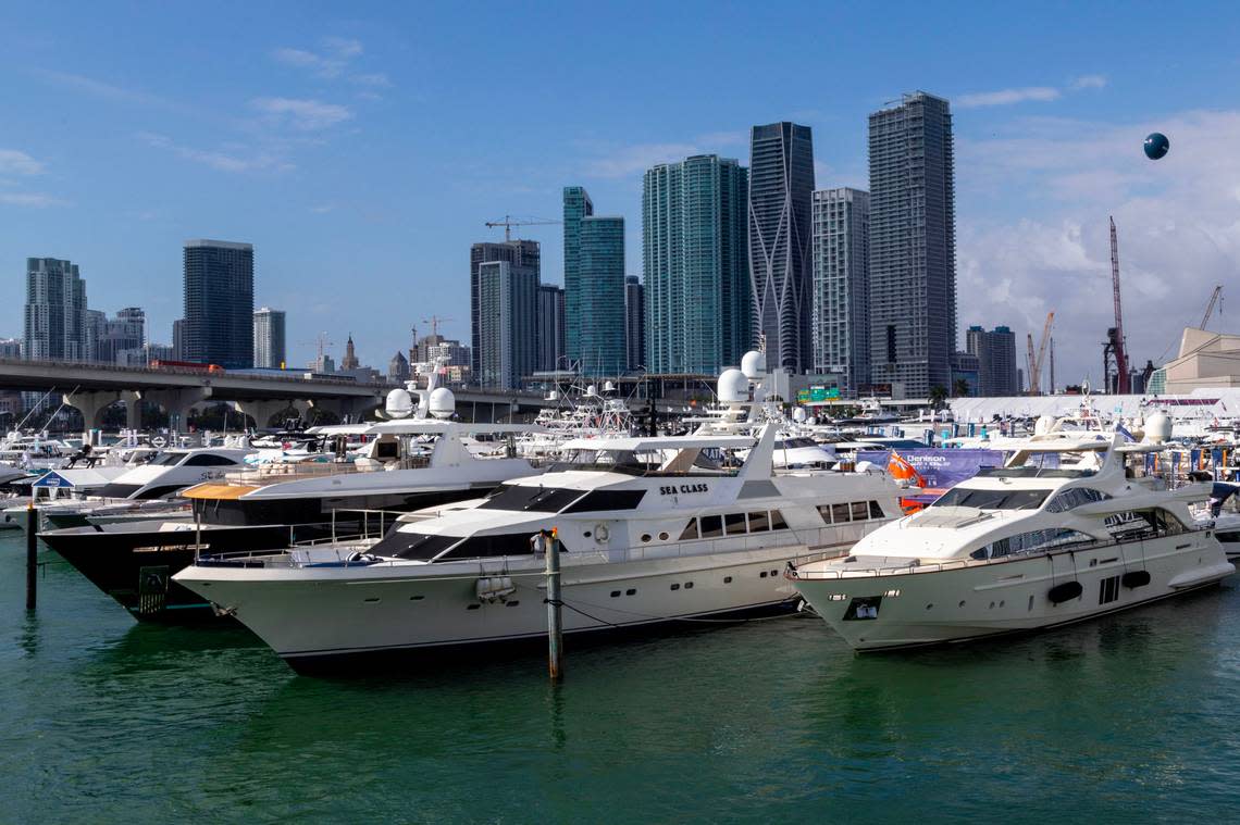 Yachts sit docked inside the temporary marina at Herald Plaza during the Miami International Boat Show in Miami, Florida, on Friday, Feb. 17, 2023. Brokers at the trade fair said they do not use Burmese teak or said they did not know where the teak on their boats was sourced from.