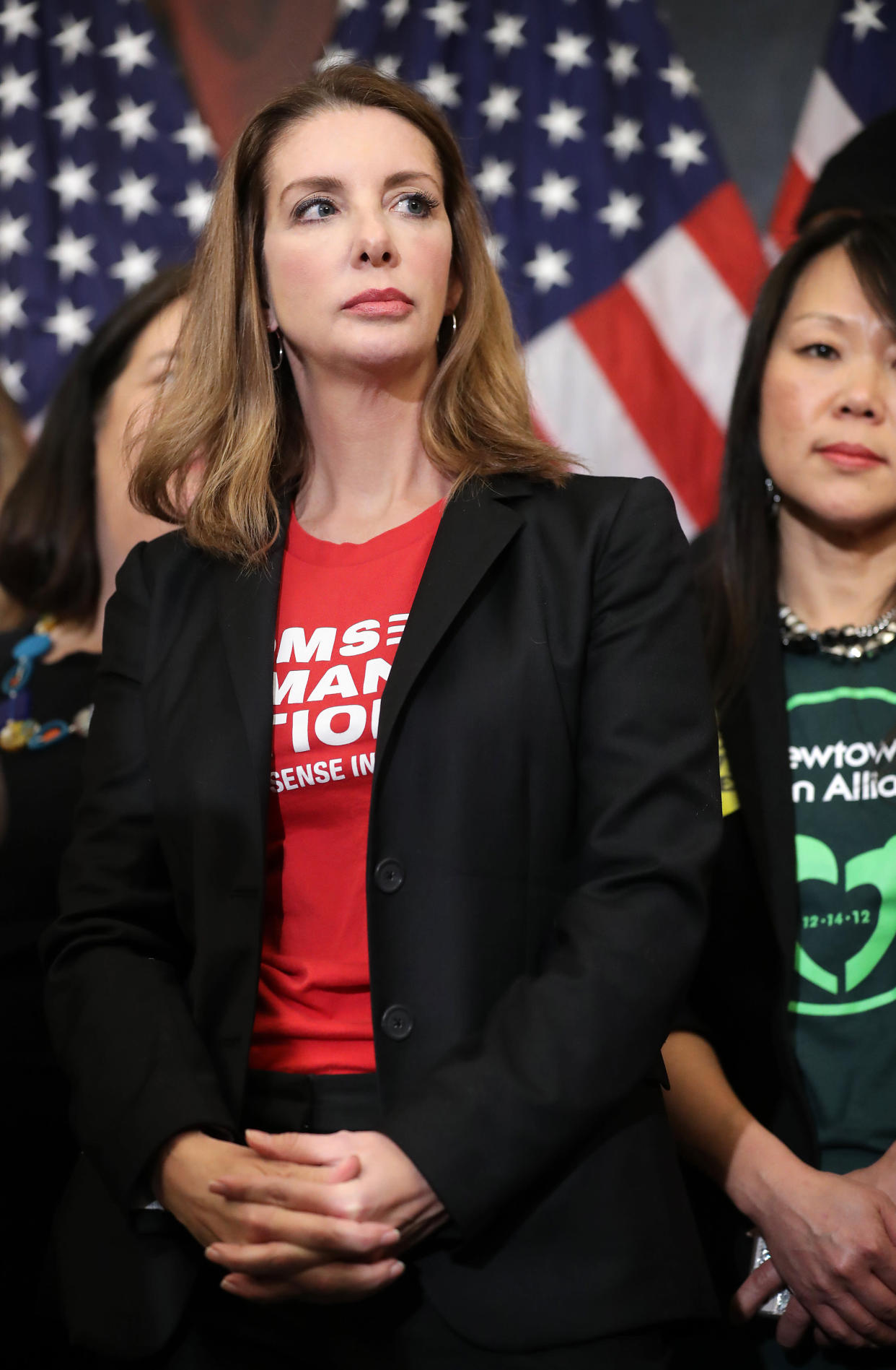 WASHINGTON, DC - JANUARY 08: Founder of Moms Demand Action for Gun Sense founder Shannon Watts  joins other gun safety advocates for a news conference to introduce legislation to expand background checks for firearm sales in the Rayburn Room of the U.S. Capitol January 08, 2019 in Washington, DC. Eight years to the day that Giffords was shot at a constituent meeting in Tuscon, Arizona, Speaker Nancy Pelosi (D-CA) unveiled a universal background check bill that House Democrats hope to pass within the first 100 days of the new Congress.   (Photo by Chip Somodevilla/Getty Images)