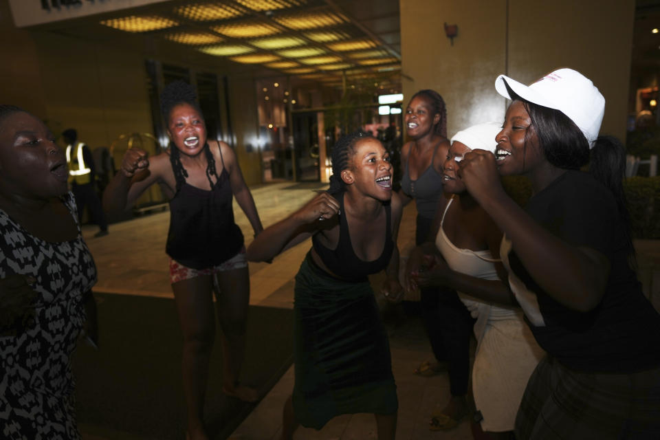 Supporters of President Emmerson Mnangagwa celebrate after he was declared the winner by the Zimbabwe Electoral Commission in Harare, Zimbabwe, on Saturday, Aug. 26, 2023. This would be Mnangagwa's second and final five year term after winning disputed polls in 2018. (AP Photo/Tsvangirayi Mukwazhi)