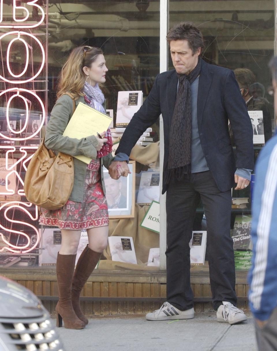 NEW YORK - DECEMBER 6: Drew Barrymore (L) and Hugh Grant appear on the set of 