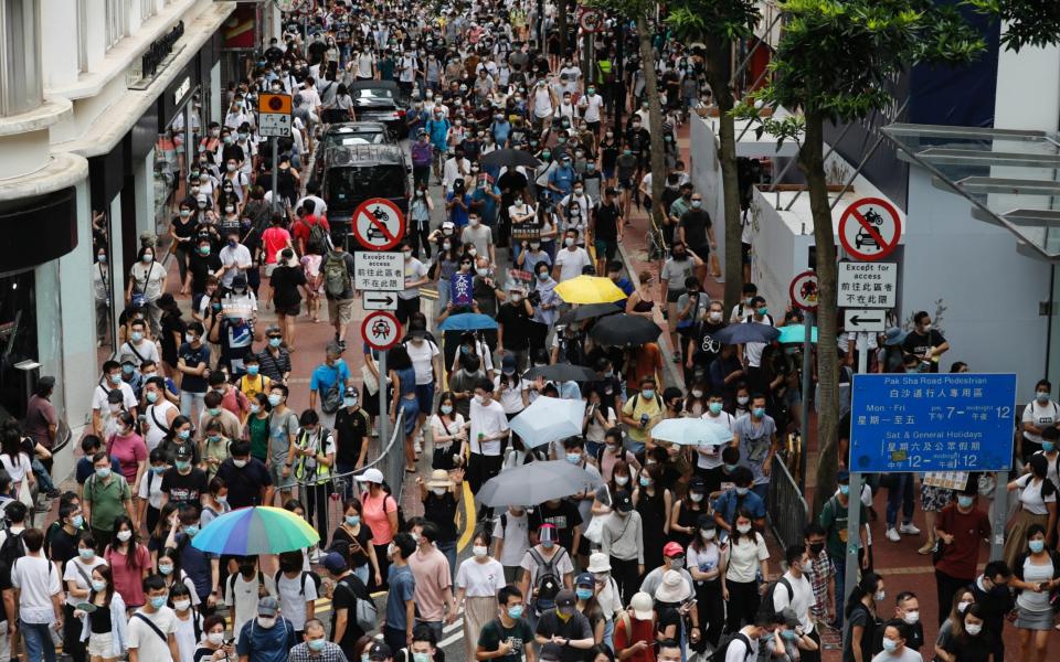 Anti-national security law protesters march at the anniversary of Hong Kong's handover to China from Britain in Hong Kong - Tyrone Hu