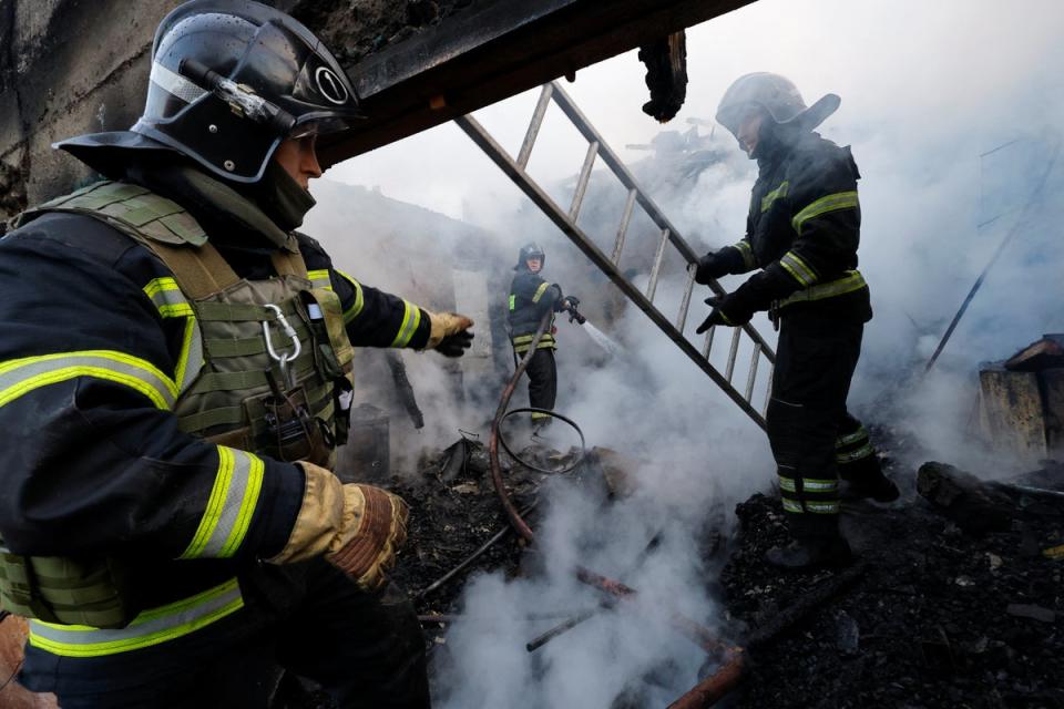 Firefighters work in a destroyed building hit by shelling in a residential area in Donetsk, Russian-controlled Ukraine (REUTERS)