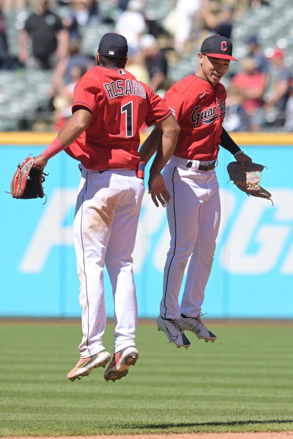 Guardians shortstop Amed Rosario (1) and left fielder Steven Kwan celebrate after their win over the Minnesota Twins, June 28, 2022, in Cleveland.