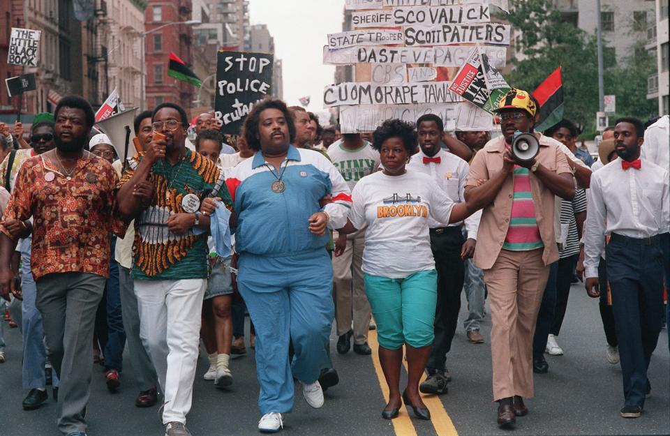 Advisers to Tawana Brawley included the Rev. Al Sharpton, center in blue track suit. He and others led a march to New York City Mayor Ed Koch's residence on Aug. 28, 1988.