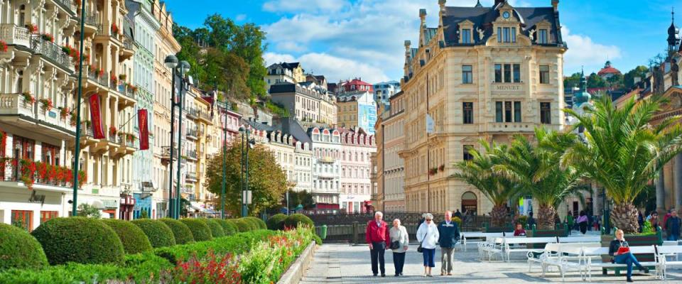 KARLOVY VARY, CZECH REPUBLIC - SEPTEMBER 20, 2012: People walking along Hot springs colonnade in Karlovy Vary.