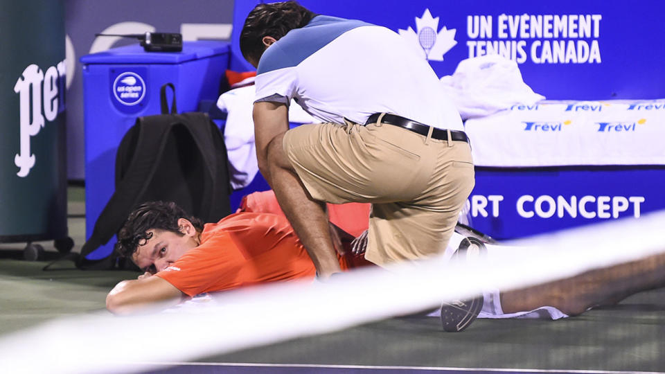 Milos Raonic was forced to retire hurt with another back injury.  (Photo by Minas Panagiotakis/Getty Images)