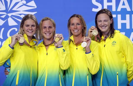 Swimming - Gold Coast 2018 Commonwealth Games - Women's 4 x 100m Freestyle Relay Final - Optus Aquatic Centre - Gold Coast, Australia - April 5, 2018. Gold medalists Shayna Jack, Bronte Campbell, Emma McKeon and Cate Campbell of Australia celebrate on the podium. REUTERS/David Gray