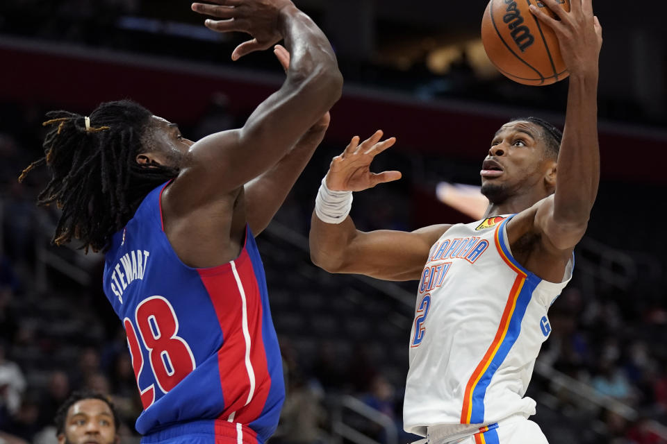 Oklahoma City Thunder guard Shai Gilgeous-Alexander (2) is defended by Detroit Pistons center Isaiah Stewart (28) during the second half of an NBA basketball game, Monday, Dec. 6, 2021, in Detroit. (AP Photo/Carlos Osorio)