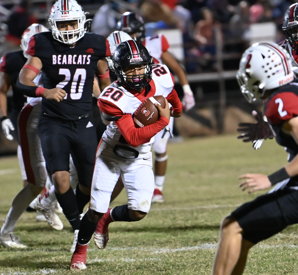 Sonora High School's Jaime Buitron (20) looks upfield as he gets through a hole in the Ballinger defensive line during a District 2-3A Division II football game Friday, Nov. 5, 2021, at Ballinger's Bearcat Stadium.