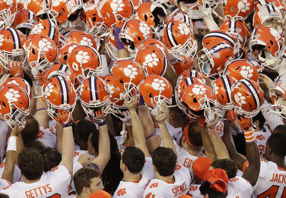 FILE - In this Jan. 7, 2019, file photo, Clemson players huddle before the NCAA college football playoff championship game against Alabama, in Santa Clara, Calif. For the first time, the defending national champion Tigers are No. 1 in The Associated Press preseason Top 25 presented by Regions Bank, Monday, Aug. 19, 2019. (AP Photo/Jeff Chiu, File)
