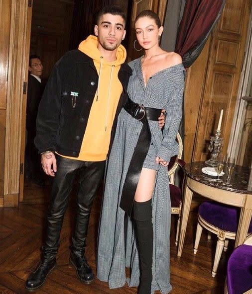 <p>In a grey, off-the-shoulder Adam Selman dress and belt with thigh-high Tony Bianco boots and Jennifer Fisher hoop earrings while out with Zayn Malik in Paris. </p>