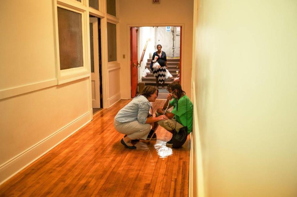 Jaynell “KK” Assmann consoles Chris Culp in the hallways of Care Beyond the Boulevard at the Independence Boulevard Christian Church in Kansas City. Zachary Linhares/zlinhares@kcstar.com