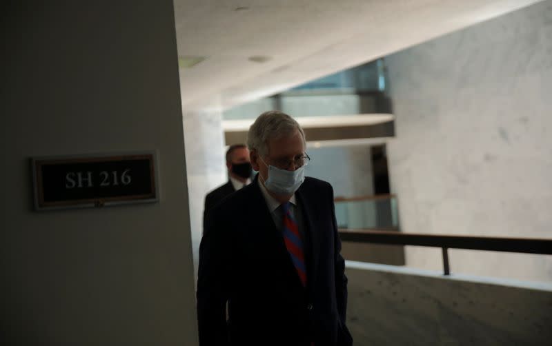 U.S. Senate Majority Leader Mitch McConnell walks down a hallway during coronavirus outbreak on Capitol Hill in Washington
