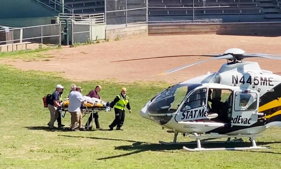 Salman Rushdie is loaded into a MedEvac helicopter after he was attacked while on stage at an event in Chautauqua, New York.