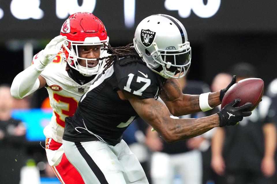 Nov 26, 2023; Paradise, Nevada, USA; Las Vegas Raiders wide receiver Davante Adams (17) makes a catch as Kansas City Chiefs cornerback L'Jarius Sneed (38) defends during the second quarter at Allegiant Stadium. Mandatory Credit: Stephen R. Sylvanie-USA TODAY Sports