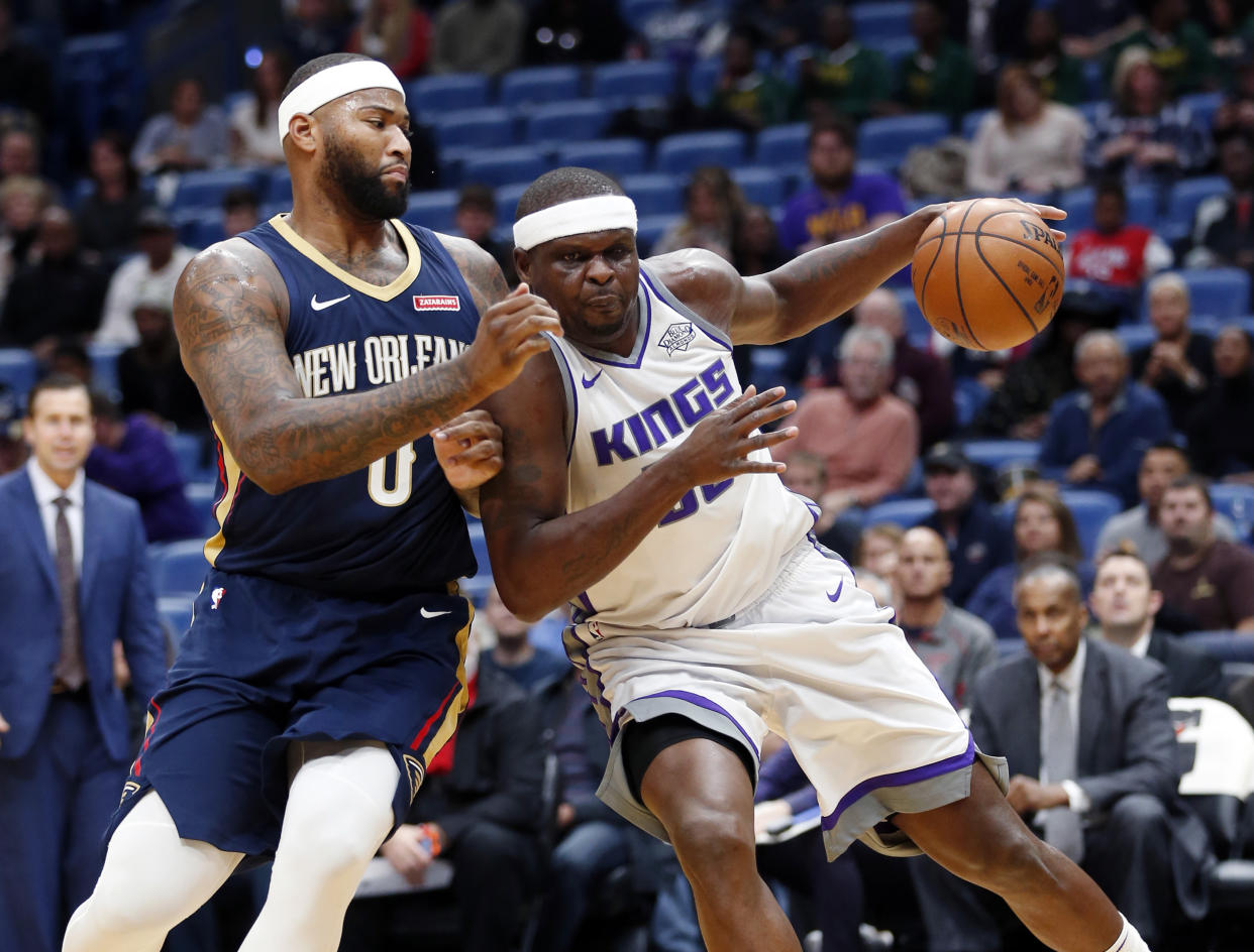 Zach Randolph and DeMarcus Cousins exchanged some words Friday night. (AP Photo/Gerald Herbert)