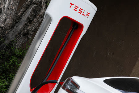 A Tesla super charger is shown at one of the company's charging stations in San Juan Capistrano, California, U.S., May 30, 2018. REUTERS/Mike Blake/Files