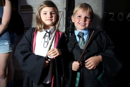 Fans in costume queue at an event to mark the release of the book of the play of Harry Potter and the Cursed Child parts One and Two at a bookstore in London, Britain July 30, 2016. REUTERS/Neil Hall