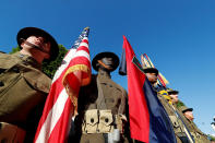 <p>U.S. troops, with soldiers wearing WWI helmets, are seen prior to the start of the traditional Bastille day military parade on the Champs-Elysees in Paris, France, July 14, 2017. (Photo: Yves Herman/Reuters) </p>