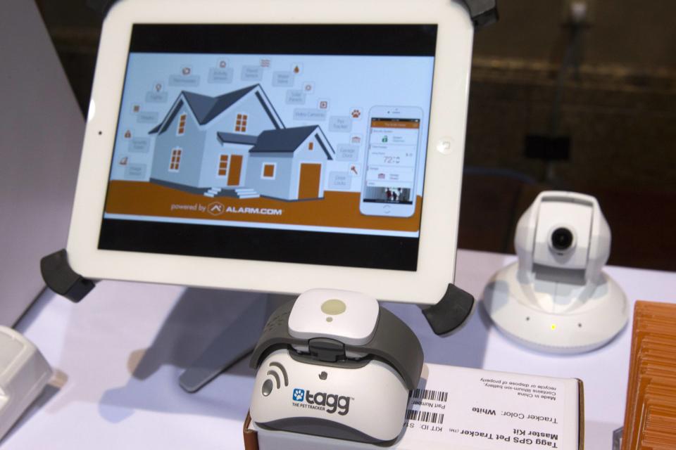 A Tagg pet tracker is shown at an Alarm.com booth during the 2015 International Consumer Electronics Show (CES) in Las Vegas, Nevada January 4, 2015. A new partnership between the companies incorporates pet tracking features with the home automation functions of Alarm.com Apps. REUTERS/Steve Marcus