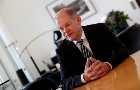 German Finance Minister Olaf Scholz is pictured in his office during an interview with Reuters in Berlin