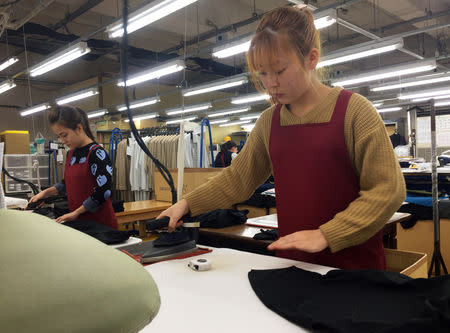 Technical trainees from Vietnam work at a knitwear factory in Mitsuke, Japan, February 26, 2019. REUTERS/Linda Sieg