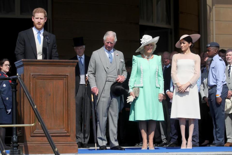 Harry gives a speech as the royals arrive at the party (Getty Images)