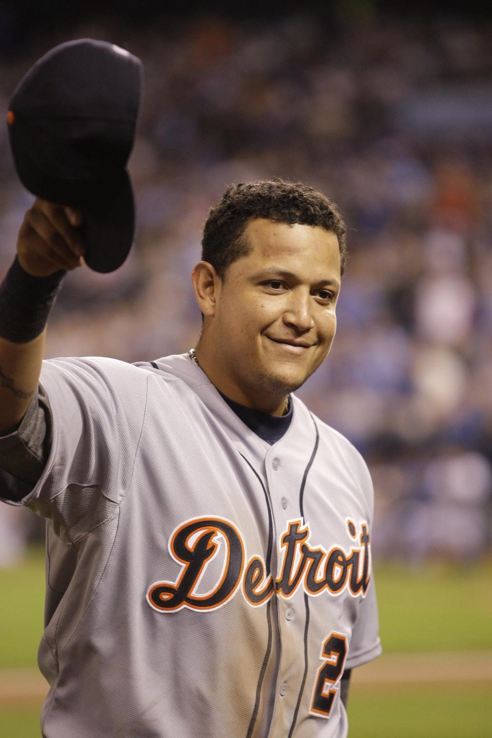 Detroit Tigers Miguel Cabrera waves his cap to the crowd after being taken out of the game in the fourth inning against the Kansas City Royals in Kansas City, Missouri, on Wednesday, October 3, 2012.