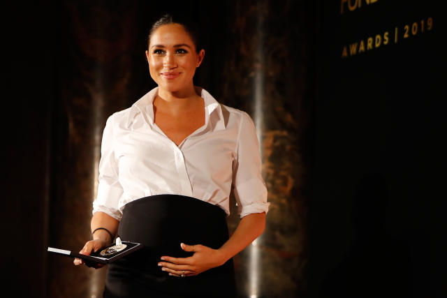Meghan Markle presents the Celebrating Excellence Award to Nathan Forster on Feb. 7, 2019, in London. (Photo: Tolga Akmen — WPA Pool/Getty Images)