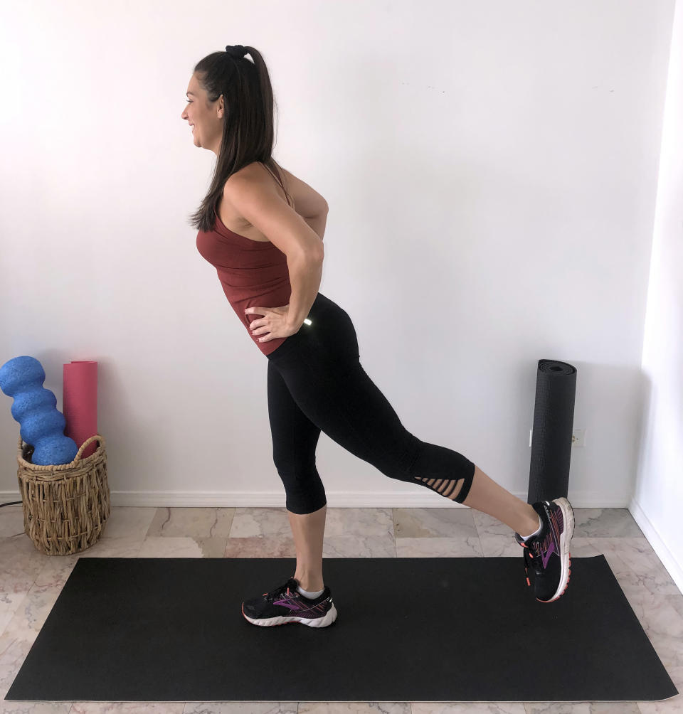 Standing leg lift to the back (Stephanie Mansour)