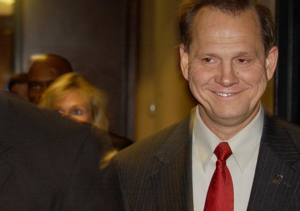 Alabama Supreme Court Chief Justice Roy Moore walks towards the Judiciary Committee Office to answer question before a State Ethics Comittee about his refusal adhere to the ruling by Federal Judge Myron Thompson to remove Moore's Ten Commandments Monument from the Rotunda of the State Supreme Court Building Friday August 22, 2003. David Alan Planchet Advertiser