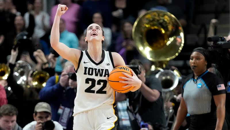 Iowa guard Caitlin Clark (22) celebrates after defeating LSU in the Elite Eight round during the NCAA Tournament, Monday, April 1, 2024, in Albany, N.Y.