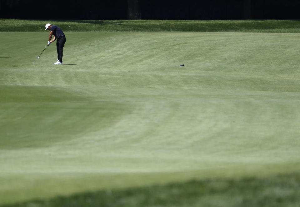 Brooks Koepka hits on the eighth fairway during the second round of the PGA Championship golf tournament at Bellerive Country Club, Friday, Aug. 10, 2018, in St. Louis. (AP Photo/Jeff Roberson)