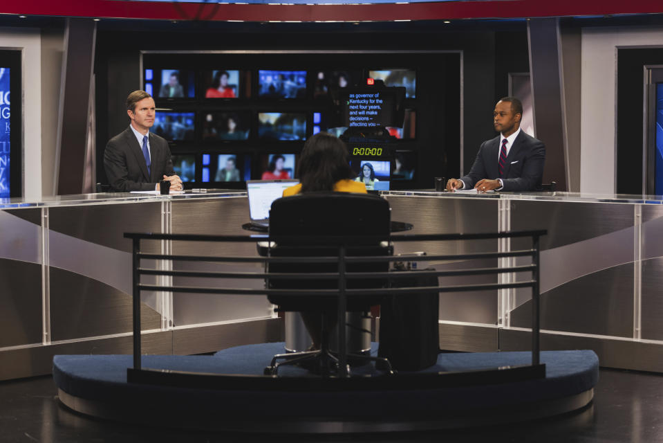 FILE - Moderator Renee Shaw, center, talks with Kentucky gubernatorial candidates, Democratic Gov. Andy Beshear, left, and Republican Attorney General Daniel Cameron, right, during a debate at KET Network Center in Lexington, Ky., Monday, Oct. 23, 2023. Beshear and Cameron have reached the end of their hard-hitting campaign for governor in Kentucky. After months of sparring over abortion and the economy, they'll await the verdict from voters Tuesday, Nov. 7. (Kentucky Educational Television via AP, Pool, File)