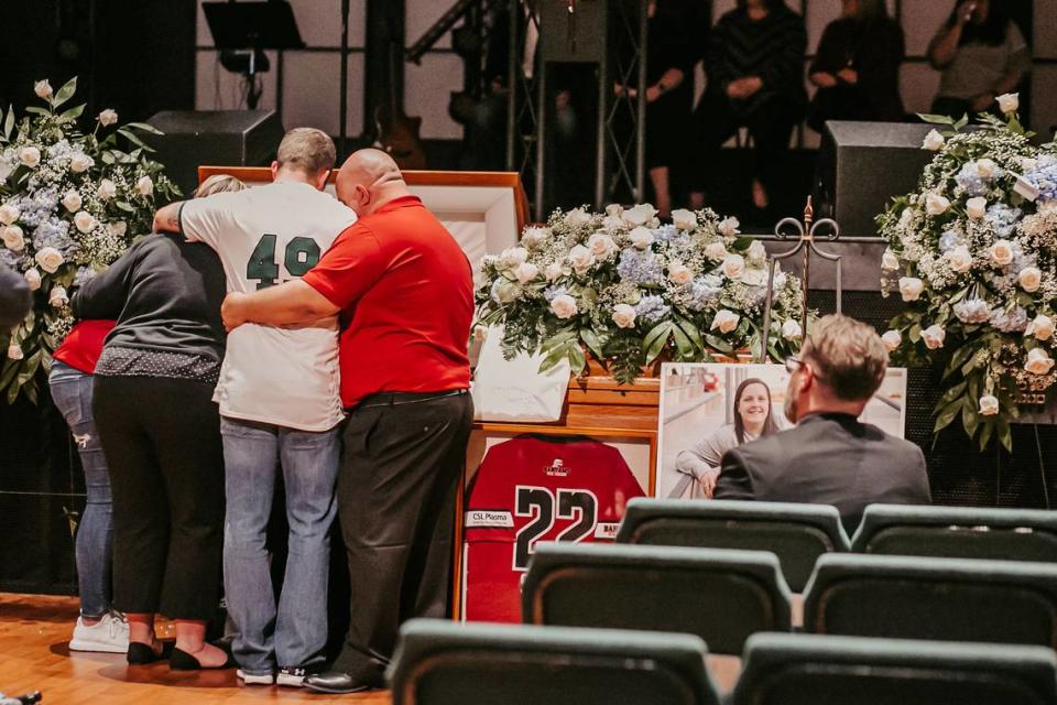 The family of Mia Stokes embraces at her funeral on Feb. 14, 2020. Stokes, 18, was killed by an allegedly drunk driver in a car crash in South Carolina.