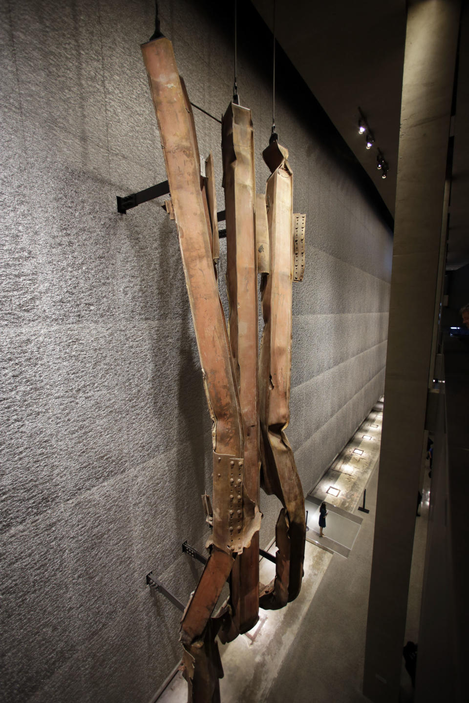 A section of steel facade, from floors 96-99 of the north tower of the World Trade Center, is displayed at the National Sept. 11 Memorial Museum, Wednesday, May 14, 2014, in New York. The museum is a monument to how the Sept. 11 terror attacks shaped history, from its heart-wrenching artifacts to the underground space that houses them amid the remnants of the fallen twin towers' foundations. It also reflects the complexity of crafting a public understanding of the terrorist attacks and reconceiving ground zero. (AP Photo)