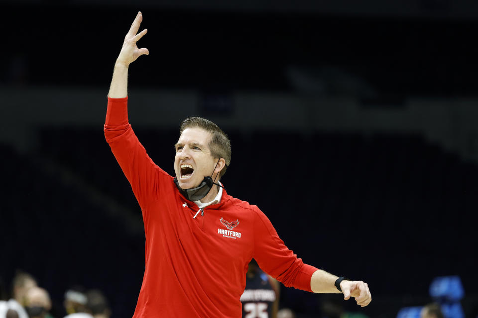 INDIANAPOLIS, INDIANA - MARCH 19: Head coach John Gallagher of the Hartford Hawks reacts during their game against the Baylor Bears in the first round of the 2021 NCAA Men's Basketball Tournament at Lucas Oil Stadium on March 19, 2021 in Indianapolis, Indiana. (Photo by Tim Nwachukwu/Getty Images)