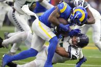 Seattle Seahawks linebacker Cody Barton (57) tackles Los Angeles Rams running back Cam Akers during the first half of an NFL football game Sunday, Dec. 4, 2022, in Inglewood, Calif. (AP Photo/Marcio Jose Sanchez)