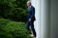 US President Joe Biden walks into the Rose Garden from the Oval Office (AFP/Brendan SMIALOWSKI)