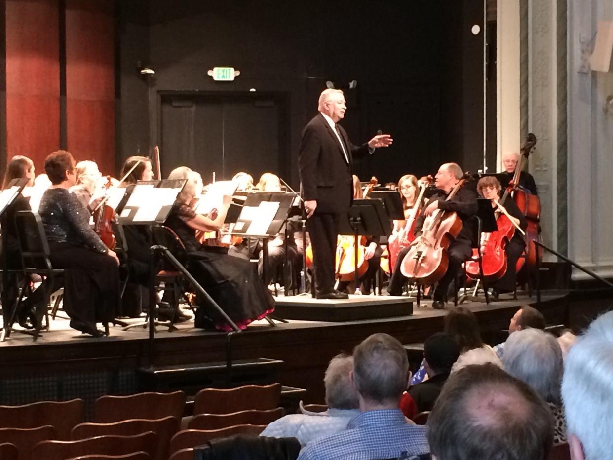 Conductor Jay Conard speaks to the audience during a Richmond Community Orchestra performance at Earlham College.