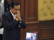 Thailand's Prime Minister Prayuth Chan-ocha gestures in a traditional greeting to National Legislative Assembly members at the parliament in Bangkok, Thailand, May 21, 2015. REUTERS/Chaiwat Subprasom