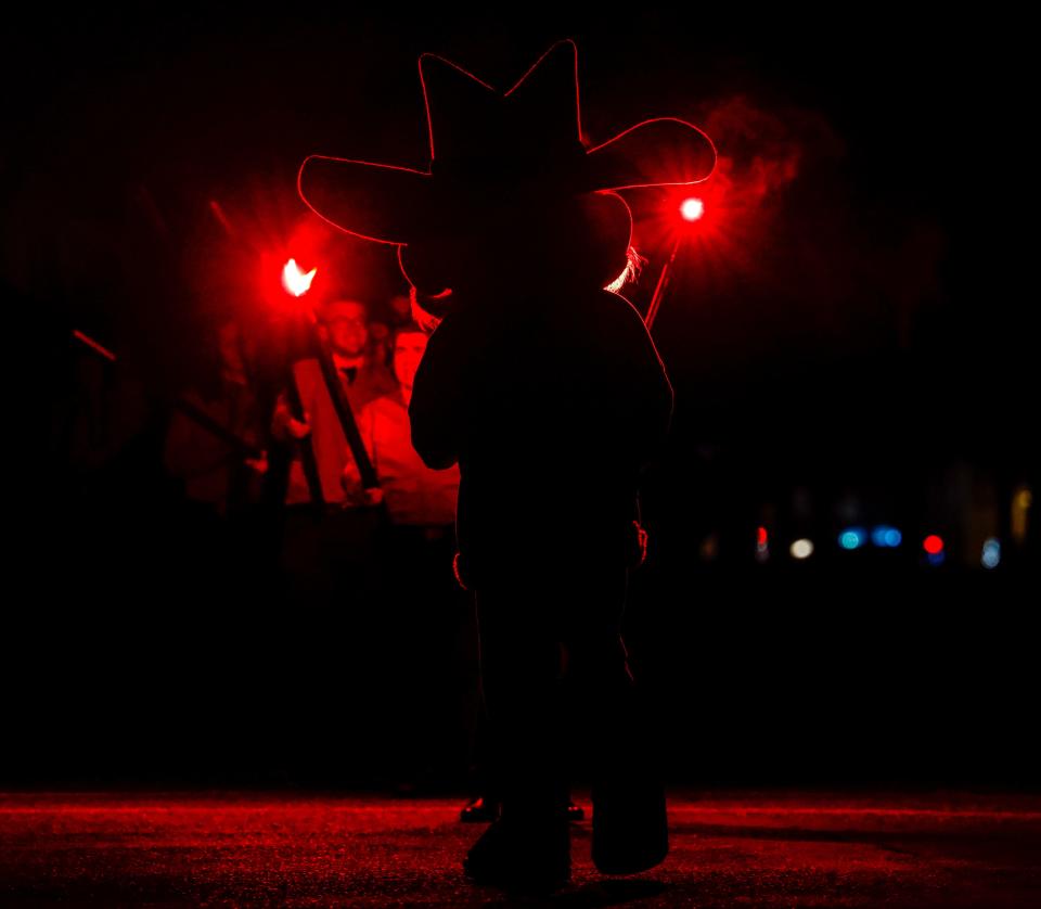 Raider Red waits to lead the Saddle Tramps out during the Carol of Lights ceremony on Tuesday, Nov. 30, 2021 at Memorial Circle on the Texas Tech campus in Lubbock, Texas.