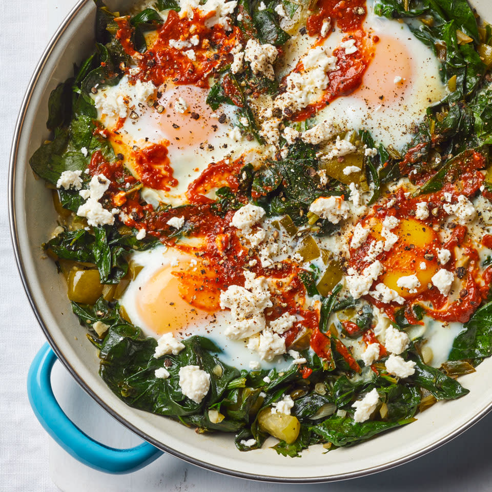 <p>This healthy skillet recipe features eggs cooked in a mixture of spinach, herbs and tomatillos. Garnish with a touch of harissa—a fiery chile paste—and dip some toasted whole-grain country bread into the jammy yolks.</p> <p> <a href="https://www.eatingwell.com/recipe/263901/skillet-eggs-with-tomatillos-spinach/" rel="nofollow noopener" target="_blank" data-ylk="slk:View Recipe;elm:context_link;itc:0;sec:content-canvas" class="link ">View Recipe</a></p>