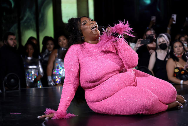 Lizzo Gives an Epic Performance in a Pink Sequin Jumpsuit and Metallic  Silver Pumps to Celebrate New Album Release