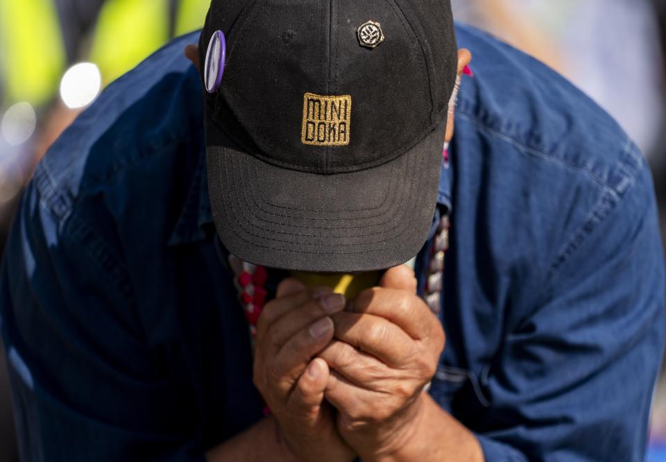 Minidoka survivor Jerry Arai bows his head in a prayer during a closing ceremony for the Minidoka Pilgrimage at the Minidoka National Historic Site, Sunday, July 9, 2023, in Jerome, Idaho. (AP Photo/Lindsey Wasson)