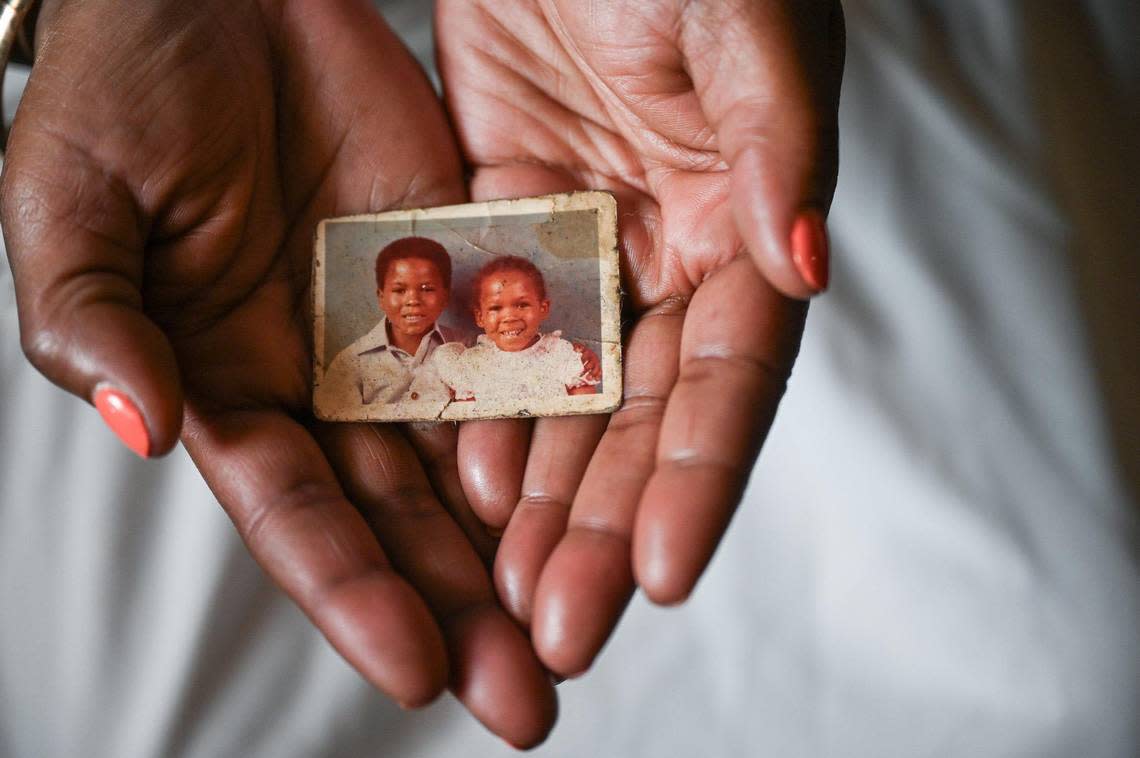 Rashida King holds a childhood photo of herself with her brother, Timothy King, who remains in prison after what she says were failed promises from Durham attorney Lisa Williams. Rashida and a cousin combined their efforts to put together the $15,000 retainer fee Williams required. After wiring the money to Williams, the only action taken was a one-hour visit with her brother in prison. she said. Two years later, she has not heard from Williams and her brother remains incarcerated.