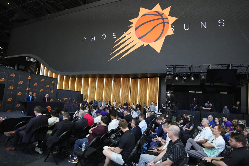 Phoenix Suns new head coach Frank Vogel, on stage right, and James Jones, on stage left, president of basketball operations and general manager for the Phoenix Suns, hold a news conference Tuesday, June 6, 2023, in Phoenix. (AP Photo/Ross D. Franklin)