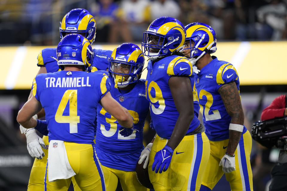 Los Angeles Rams running back Trey Ragas (32) celebrates his rushing touchdown with teammates during the second half of a preseason NFL football game against the Houston Texans Friday, Aug. 19, 2022, in Inglewood, Calif. (AP Photo/Ashley Landis)