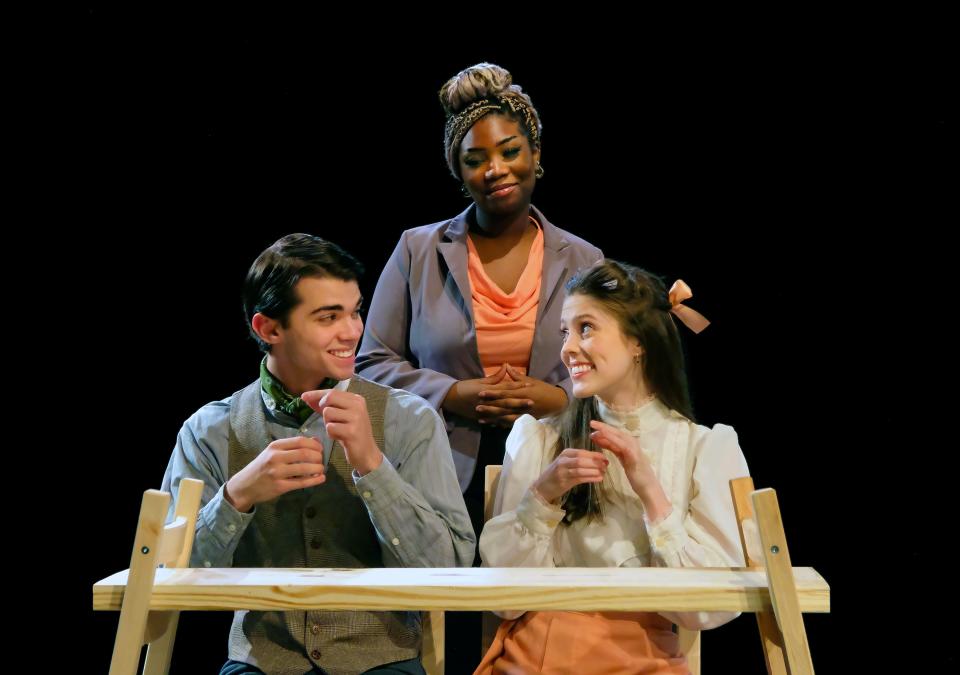 Left to right, David Graves (as George Gibbs), Kandy Boakye (the Stage Manager), and Claire Stancy (Emily Webb) in the Otterbein Department of Theatre & Dance production of "Our Town"